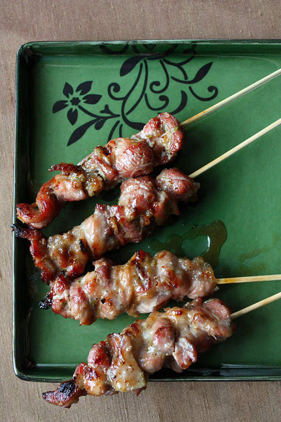 Premium Photo  Closeup of grilled skewered milk pork on stick thai street  food market